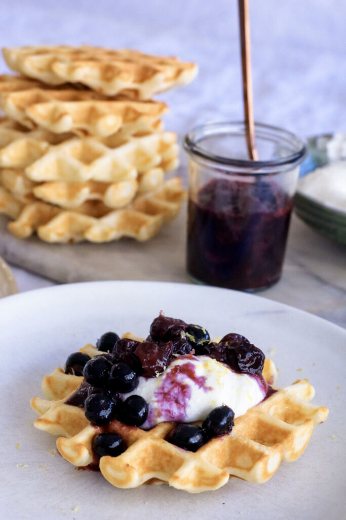 Waffles with Lemon Ricotta-Yogurt Cream and Blueberry Sauce
