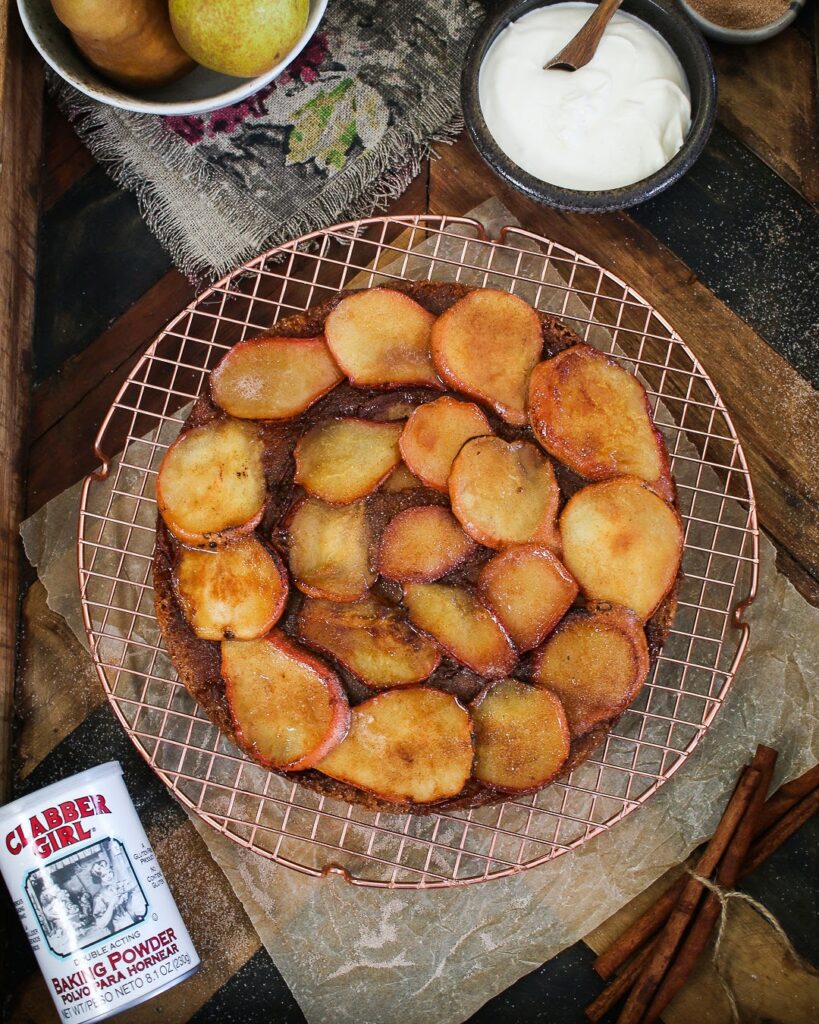 A bowl of fried peaches on top of a table.