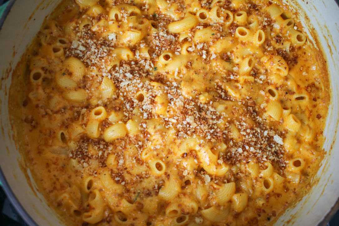 A close up of macaroni and cheese with meat