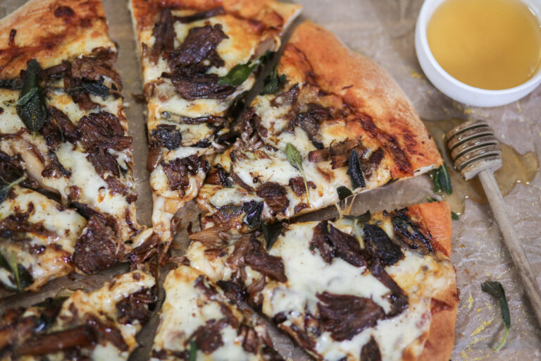 Short Rib Pizza with Honey, Caramelized Shallots, and Gruyere Sauce