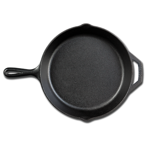 A black cast iron pan with handle on top of white table.