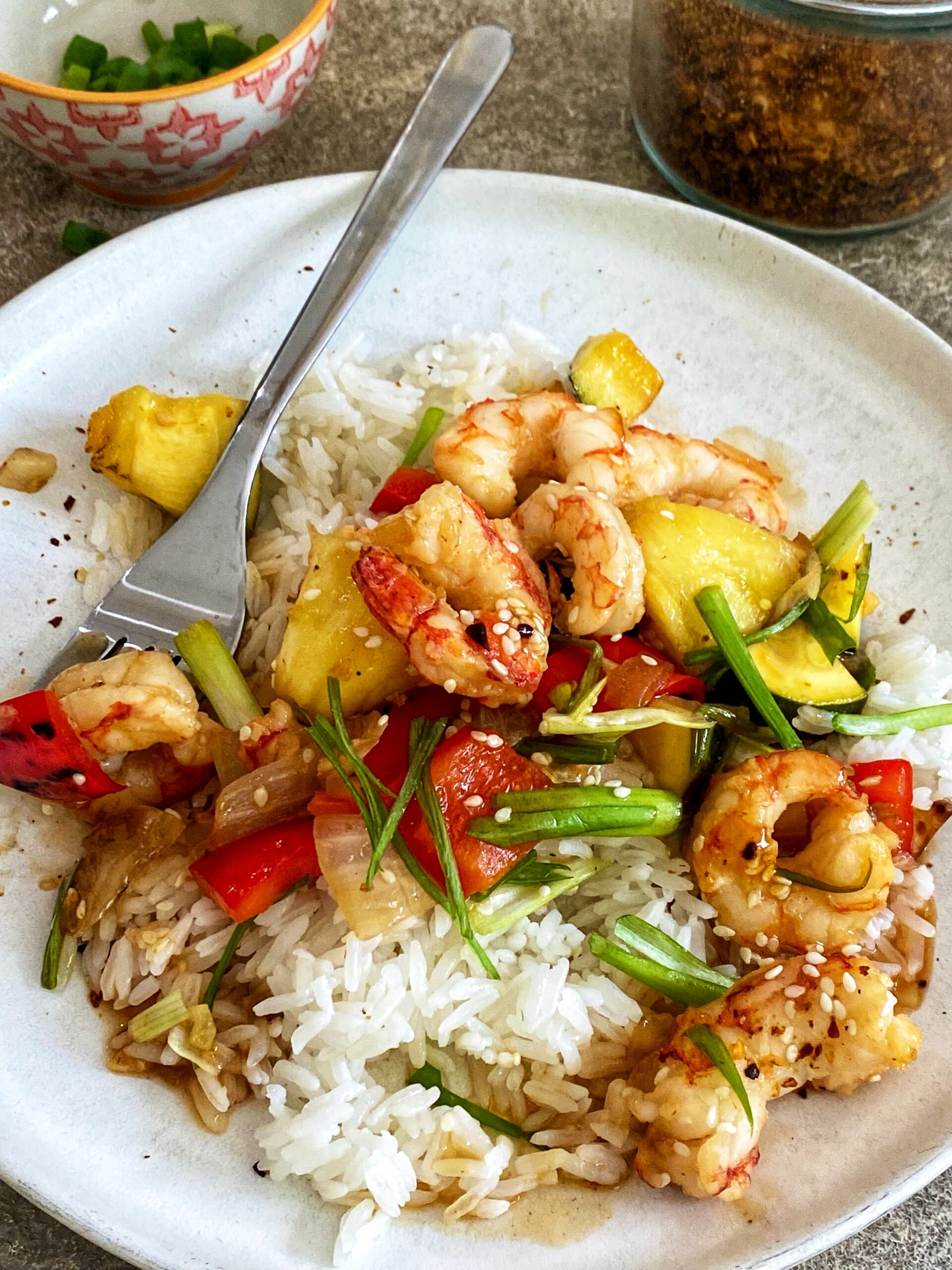 A plate of food with shrimp and rice.