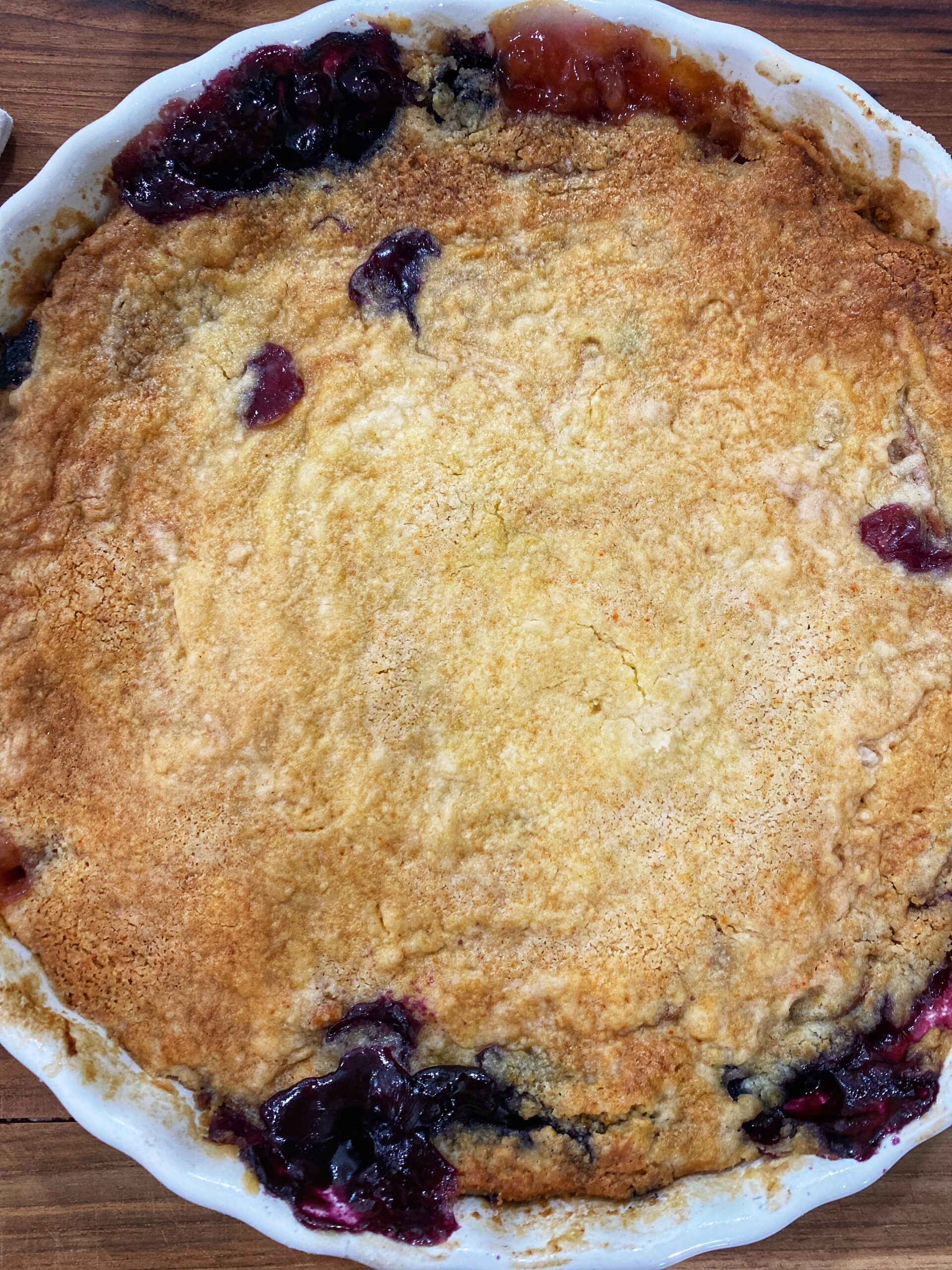 A close up of a pie with blueberries in it