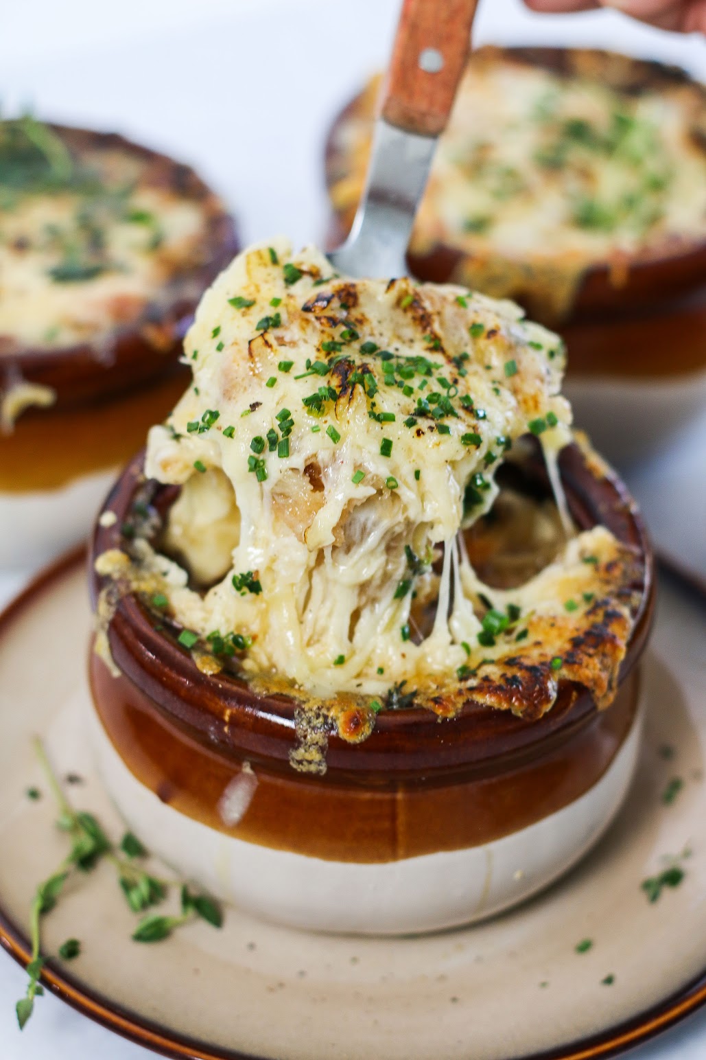 A plate of food with cheese and vegetables on it.