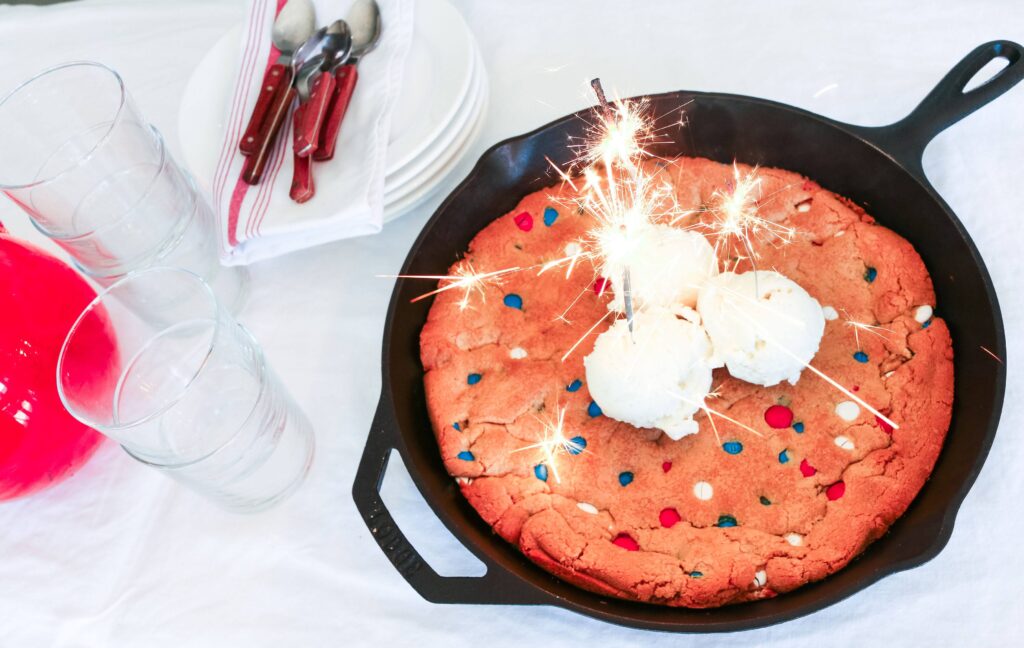 A pan of cake with candles on top.