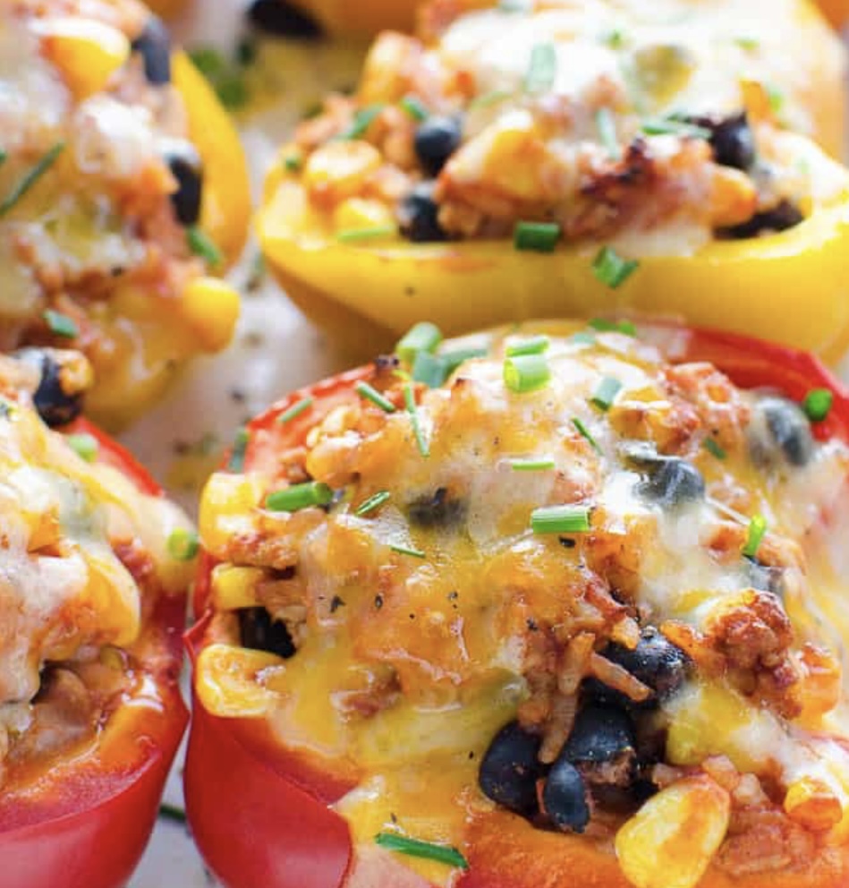 A close up of stuffed peppers with cheese
