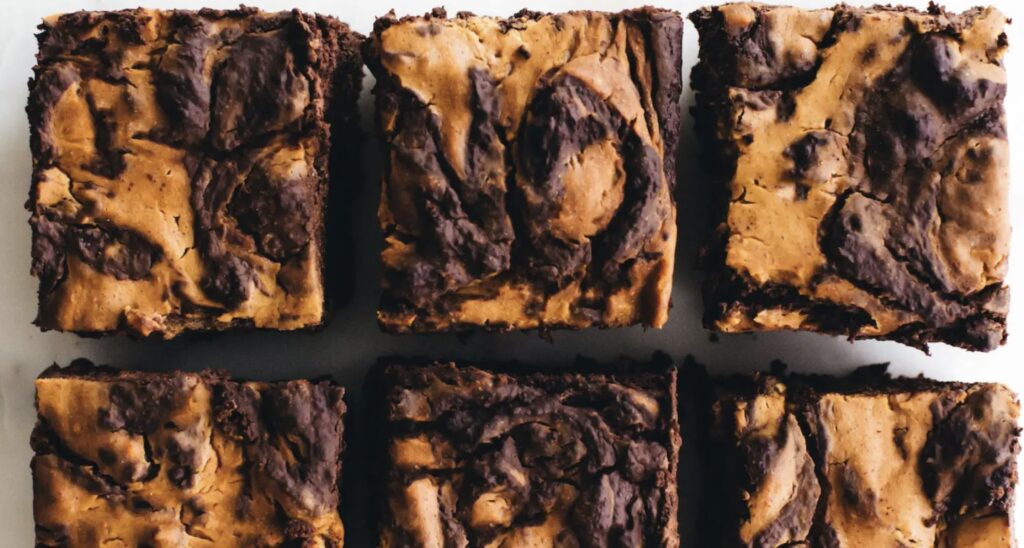 A close up of some brownies in a box
