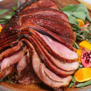 A close up of sliced ham on top of a plate