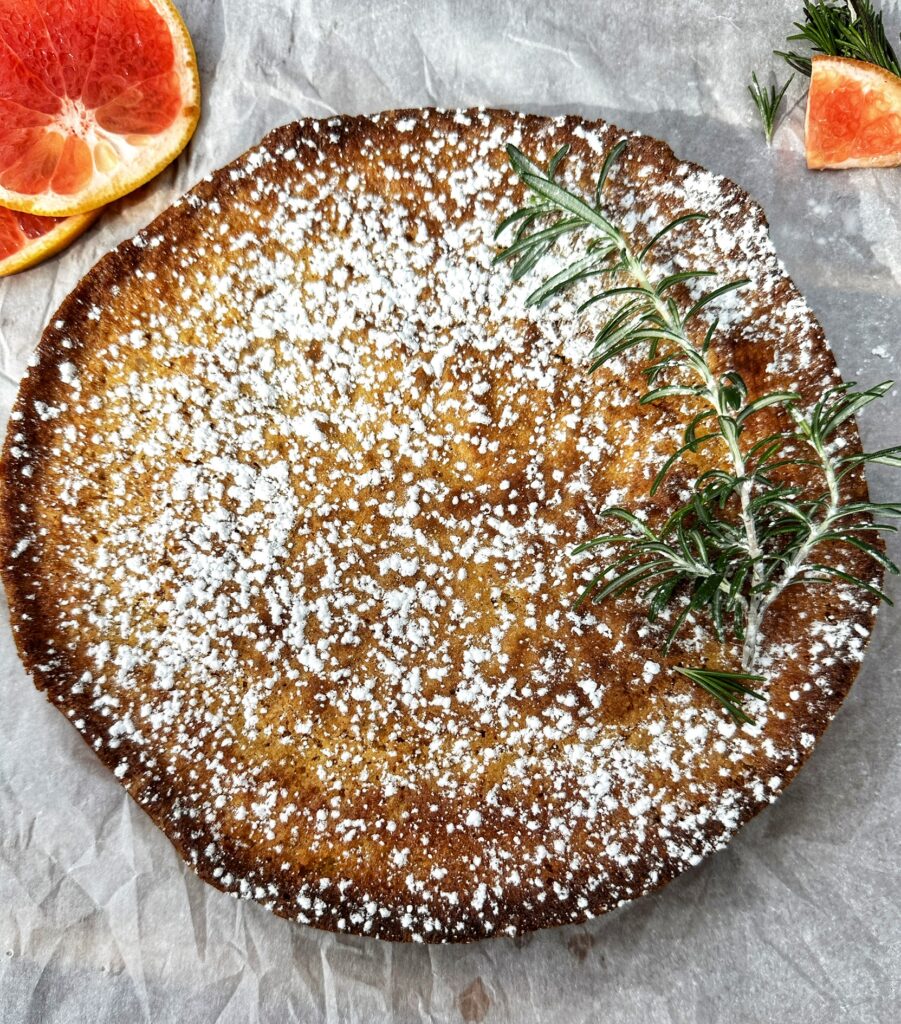 A pie with powdered sugar on top of it.