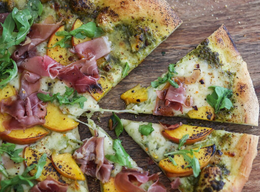 Peach, Prosciutto, and Spinach Pesto Pizza